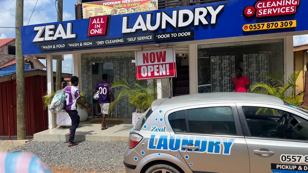Zeal Laundry storefront and pickup vehicle